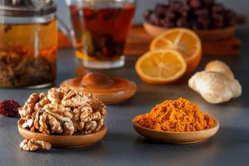 Ginger, walnut, turmeric, honey, lemon, dried rose hips and medicinal herbal tea - a means to increase immunity from the virus. Close-up