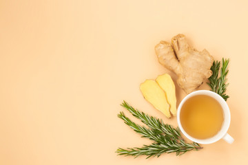 Natural anti-stress relaxing tea with ginger and rosemary on a light background