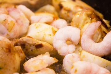 Vegetable stir fry with seafood and chicken to prepare paella