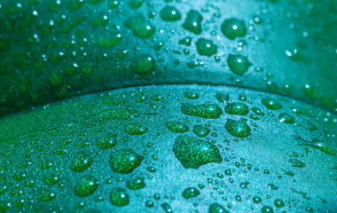 Drops of dew on a green leaf, macro, can be used as a background, screen saver, postcard for anything