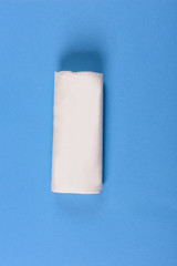 Biodegradable package isolated on the blue backround. Eco friendly.