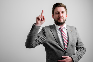 Portrait of business man wearing business clothes making idea gesture