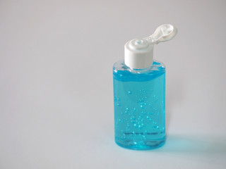 Hand Sanitizer, gel alcoholic mixture with gelatin in clear Plastic bottle with pump pushing, washing clean dirty to prevent germs protect corona virus, covid 19