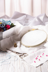 Hand embroidery kit for home made on wooden background