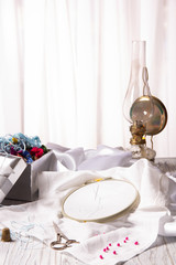 Hand embroidery kit for home made on wooden background