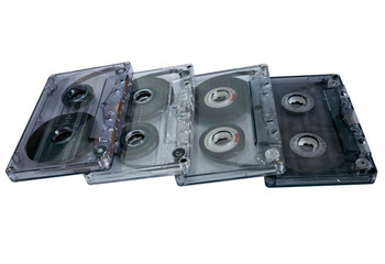 Old vintage cassette tapes on white background. Multiple classic cassette tapes.