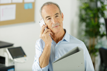 senior businessman in the phone
