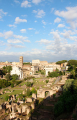 Obraz premium Aerial panoramic cityscape view of the Roman Forum and Roman Colosseum during sunset in Rome, Italy