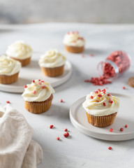 Homemade cupcakes with cream cheese and dries strawberry on white background. Party, happy...