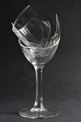 Broken wine glass photo isolate on black background copy space front view 