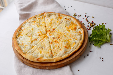 Italian Fast food pizza 4 cheeses on a white background