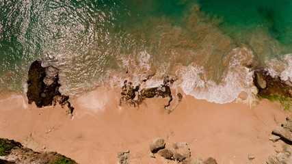 Top view of stone coast at Bali island, Tegal Wangi Beach, Bali, Indonesia. Aerial view.