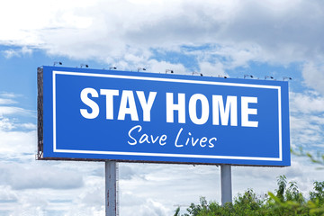 Large billboard with recommendations for stay home during. Quarantine during Coronavirus. Appeal about Covid-19.billboard with clouds on blue sky background. Warning sign about Coronavirus.
