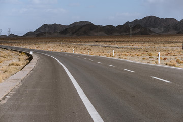Gobi desert road on vast dry wilderness