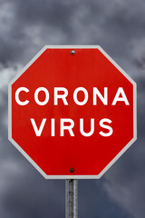Corona virus warning sign with storm clouds in background