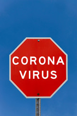 Corona virus warning sign with clear blue sky background