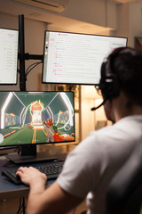 Young man in a stream of online shooter game © DC Studio