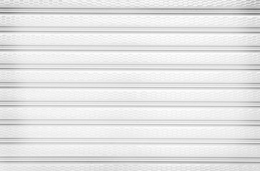 Obraz premium Rolling steel door texture or roller shutter door , white grey background