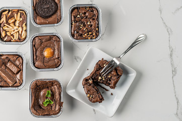 Chocolate brownies top view, brownie chocolate flatlay top view on marble background with text copy...