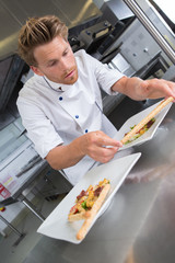 chef garnishing his appetizer plate