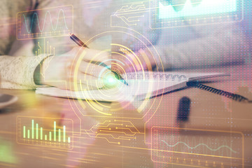 Double exposure of writing hand on background with data technology hologram. Big data concept.