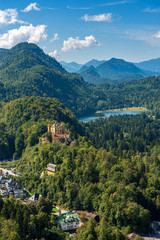 Hohenschwangau Castle (Schloss Hohenschwangau - Upper Swan County Palace XIX century) and the Schwansee Lake, landmark in the Bavarian Alps, Schwangau, Germany, Europe