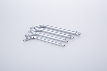 Four small steel tools  assembling and assembling furniture on a white background