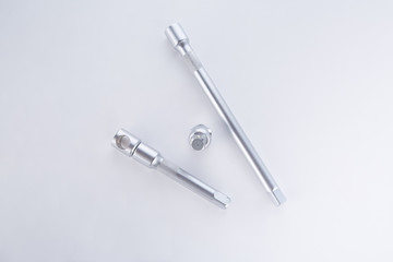 Screwdrivers and angled socket head on a white background