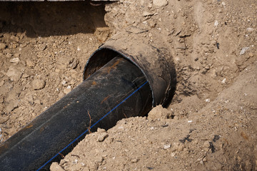 repair and replacement main pipeline of heating systems, district heating pipes network, water supply or Sewerage in city, removing old pipes and replacing them with new ones in a hole in the ground