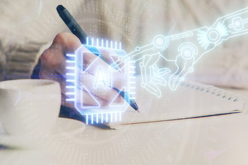 Double exposure of writing hands on background with data solution hologram on front. Technology concept. Close up
