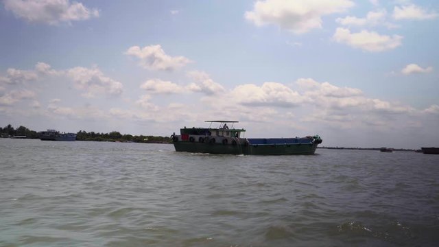 A boat pass by in Mekong river delta Vietnam.