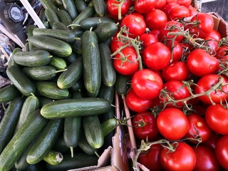 Cucumbers and tomatoes at market