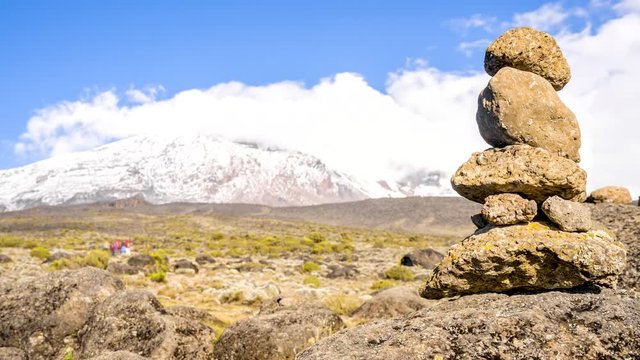 Timelapse view of Kibo with Uhuru Peak (5895m, highest mountain in Africa) at Mount Kilimanjaro, Kilimanjaro National Park. Beautiful landscape with clouds floating over the  volcano.