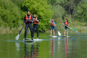 group of paddle boarders having a lesson