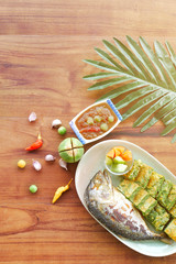 Top view The shrimp Paste, Mackerel, vegetable and Omelet with Climbing Wattle, Acacia or Cha-om on the wooden table back ground.Vintage filter.
