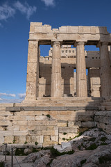 Fototapeta premium Ancient Greek ruins of Propylaea on a top of Acropolis hill in Athens. Acropolis - main tourist attraction of Athens. Greece.