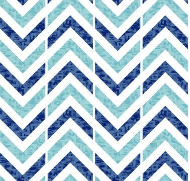 Abstract grunge chevron Ikat geometric seamless pattern. Blue zigzag waves on white background. Ethnic asian, indian, aztec fashion style. Fancy boho texture for fabric print, wallpaper, gift wrap.