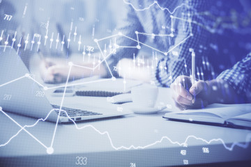 Multi exposure of forex chart with man working on computer on background. Concept of market...