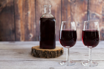 red wine rustic bottle and two red wine glasses