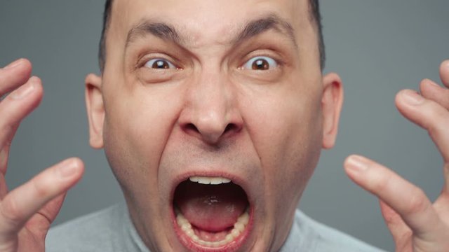 Video of young screaming man in turtleneck