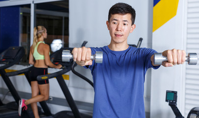 Man doing exercises with dumbbells