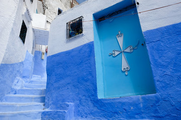 Ancient small street in blue and white in the kasbah - old part of city Chefchaouen, Morocco