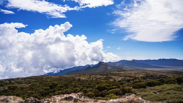 Timelapse view of Kibo with Uhuru Peak (5895m, highest mountain in Africa) at Mount Kilimanjaro, Kilimanjaro National Park. Beautiful landscape with clouds floating over the  volcano.