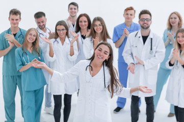 Fototapeta na wymiar large group of medical professionals applauding their leader