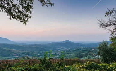 Early morning in the valley. Hills in the haze. Italy. Soft focus, blurry background.