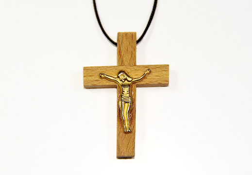 a pendant with a wooden cross