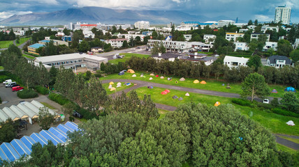 Aerial view of Reykjavik. Sports area with swimming pools, camping sites, footballs, caravans and hostels. Views of the mountains and the bay