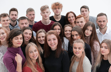 group of confident young people looking at the camera and showing their success