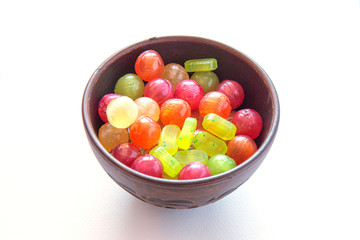 Multicolored candys on a colored background