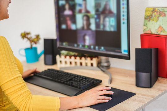 Young Woman Having A Discussion Meeting In Video Call With Her Team - Girl Having Chatting With Friends On Computer Web App - Technology And Smart Work Concept - Focus On Hand